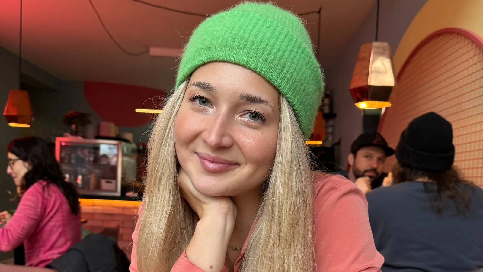Monika Zielińska smiling, in a green beanie