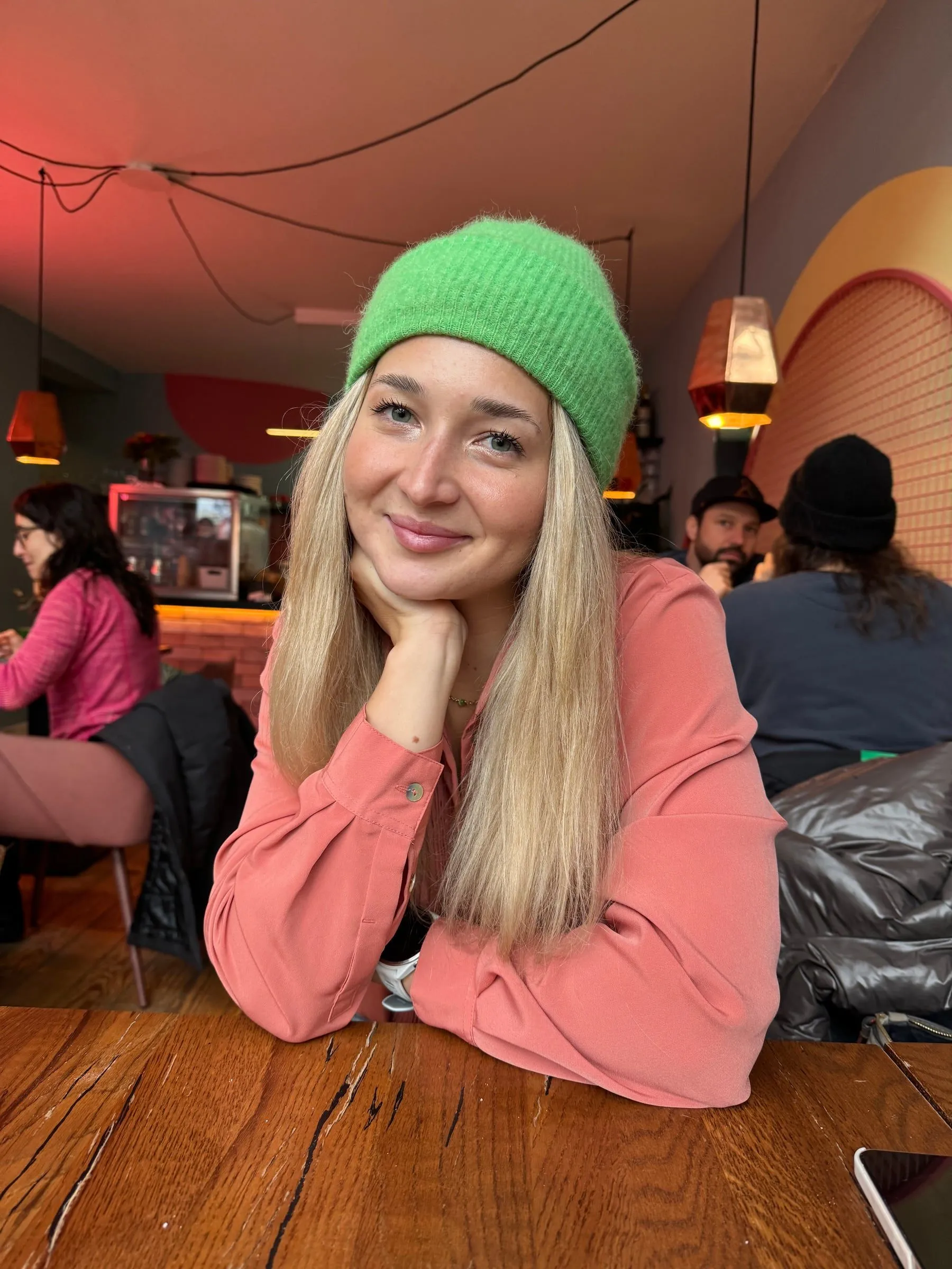 Monika Zielińska smiling, in a green beanie