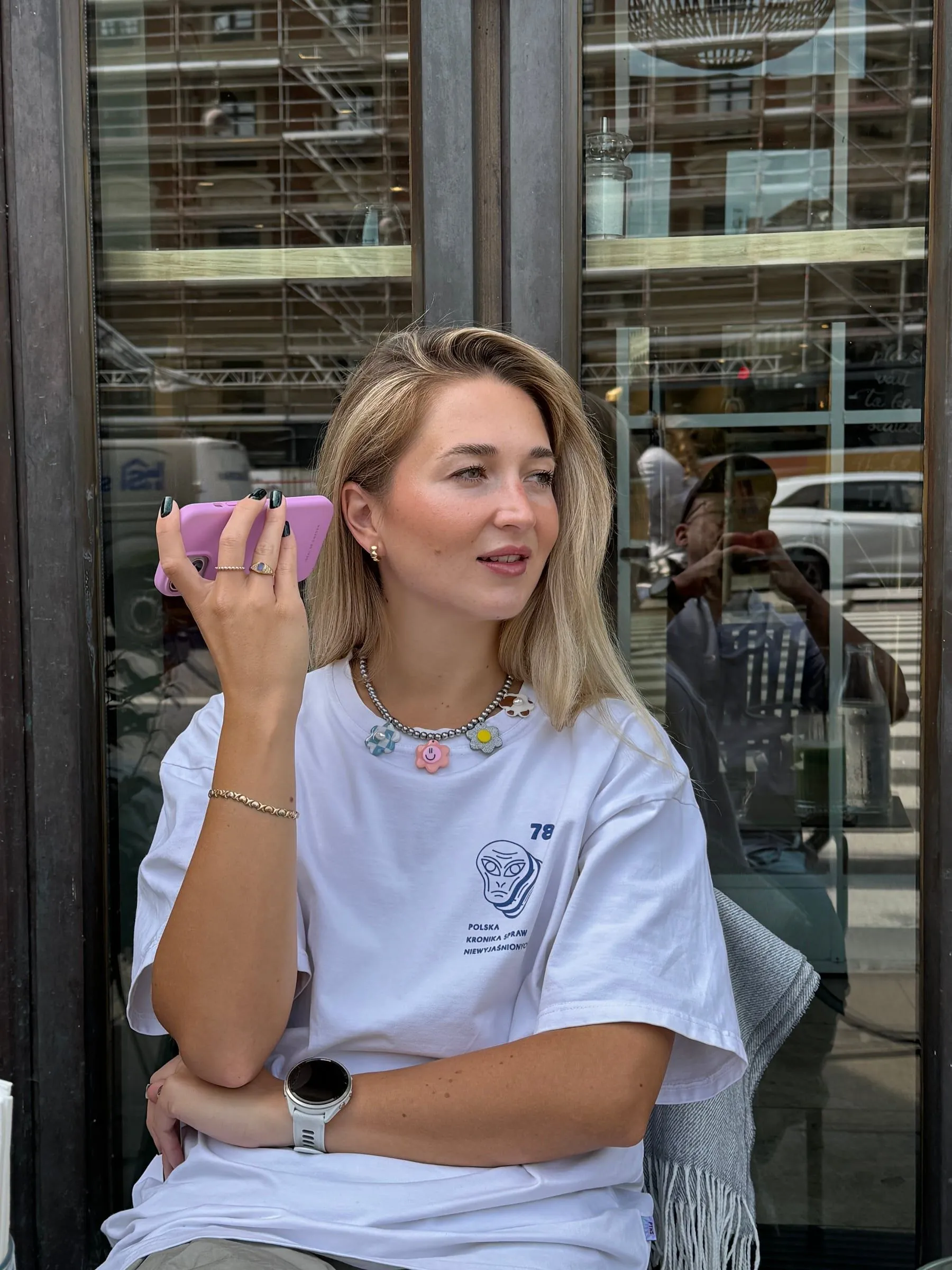 Monika Zielińska sitting by a café window